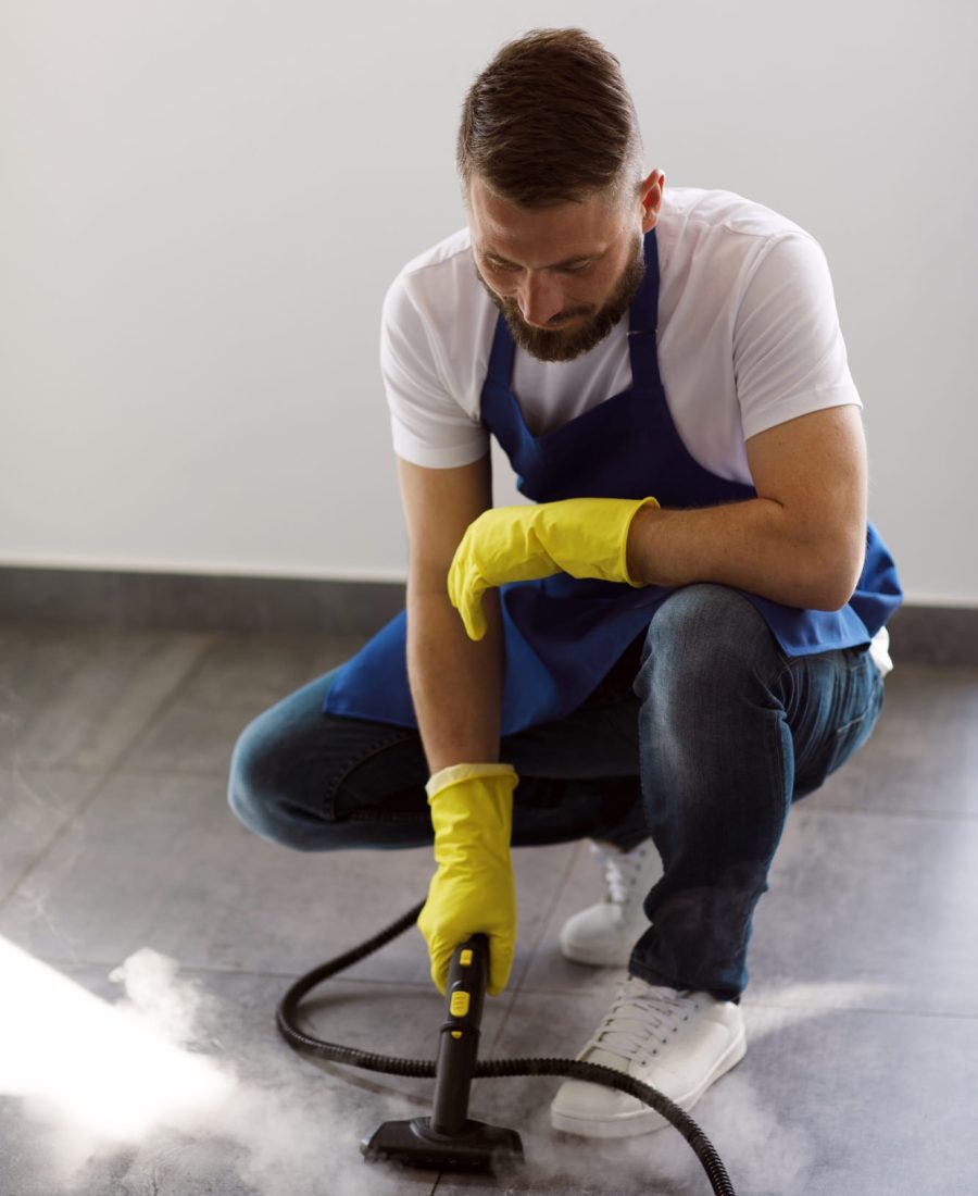 professional-cleaning-service-person-using-steam-cleaner-office-min